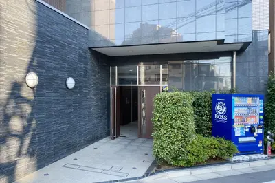 a entrance to a building with a brown door at \u5b89\u697d\u9014 in Tokyo