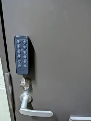a remote control is attached to a door at Home cruise\u897f\u5c0f\u5c71 in Tokyo
