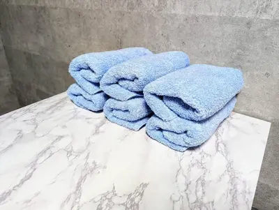 a pile of towels sitting on top of a counter at Home cruise\u897f\u5c0f\u5c71 in Tokyo