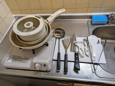 a kitchen counter with a pot and utensils on it at Home cruise\u843d\u5408\u5357\u9577\u5d0e in Tokyo