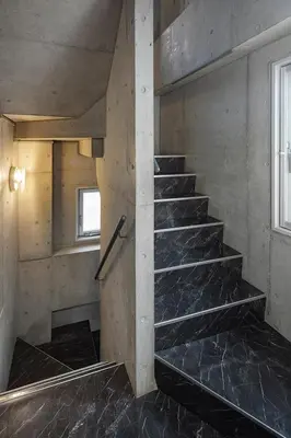 a set of stairs in a room with a window at The SAUNA Escape Shibuya in Tokyo