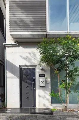 a building with a door on the side of it at The SAUNA Escape Shibuya in Tokyo