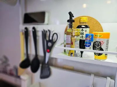 a shelf with scissors and other kitchen items on it at 703. Disneyland, direct bus to the airport/1minute's walk from the station. in Tokyo