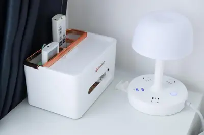 a nintendo wii game system on a table next to a lamp at Colorful House SKY TREE in Tokyo
