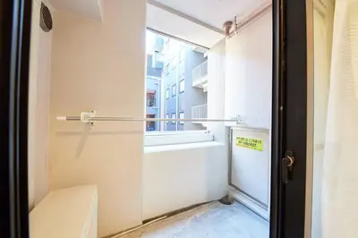 a door leading into a room with a window at Shinjuku Kabukicho Designer's Apartment III in Tokyo