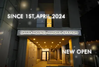 a building with a sign on the front of it at OHWA hostel minowa station in Tokyo
