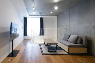 a living room with a couch and a table at Lega land\u4e09\u8ed2\u8336\u5c4bANNEX in Tokyo