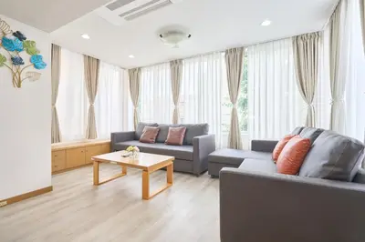 a living room with a couch and a table at K-Large balcony, Luxury 2Bedroom Condo, 101sqm,Max14 PPL,7mins walk to station, Elevator,QuiteArea in Tokyo