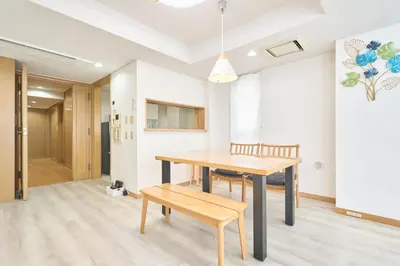 a dining room with a wooden table and chairs at K-Large balcony, Luxury 2Bedroom Condo, 101sqm,Max14 PPL,7mins walk to station, Elevator,QuiteArea in Tokyo