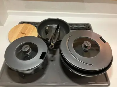 a stove top with two pans and a wooden plate at K-Large balcony, Luxury 2Bedroom Condo, 101sqm,Max14 PPL,7mins walk to station, Elevator,QuiteArea in Tokyo