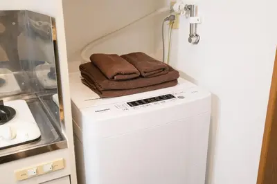 a washing machine with two brown towels on top of it at East Court Nagasaki - Vacation STAY 8634 in Tokyo