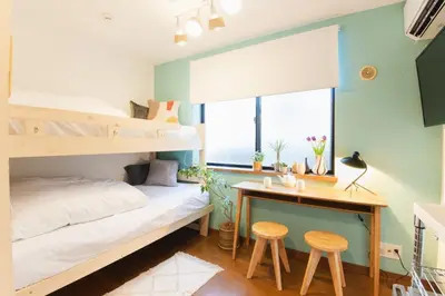 a bedroom with a bunk bed and a desk at East Court Nagasaki - Vacation STAY 13046 in Tokyo