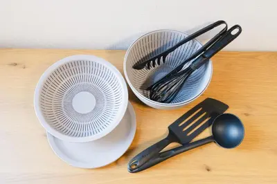 two white dishes with utensils on a wooden table at East Court Nagasaki - Vacation STAY 13035 in Tokyo