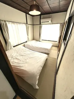 a small room with two beds and a window at Shibuya-ku - House - Vacation STAY 8663 in Tokyo