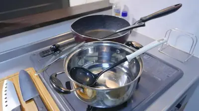 two pots and pans sitting on top of a stove at Shibuya-ku - House - Vacation STAY 8663 in Tokyo