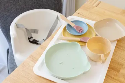 a tray with plates and utensils on a table at 