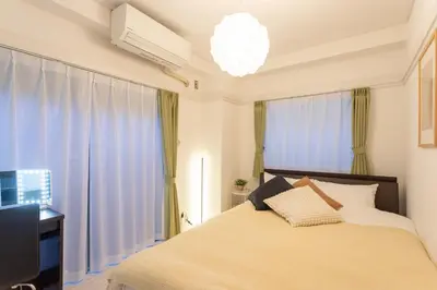 a bedroom with a bed and a chandelier at 