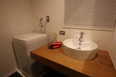 a bathroom with a sink and a toilet at \u5357\u6c60\u888b\u6238\u5efa in Tokyo