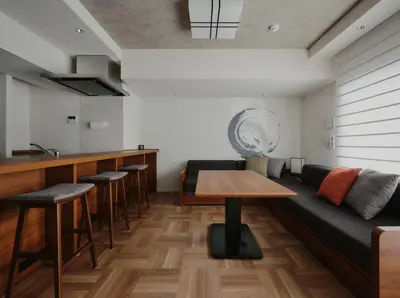 a living room with a couch and a table at MONday Apart Premium Asakusa in Tokyo