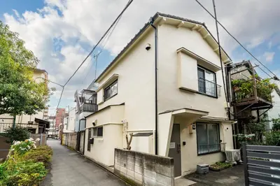 a white building on a street at 87, Senzoku, Detached house for rent, \u5343\u675f in Tokyo