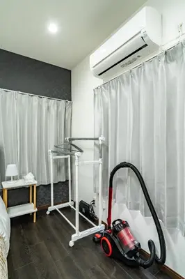 a room with a vacuum cleaner on the floor at 87, Senzoku, Detached house for rent, \u5343\u675f in Tokyo