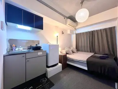 a small room with a bed and a sink at JUN shinjuku408-SJ0099 in Tokyo