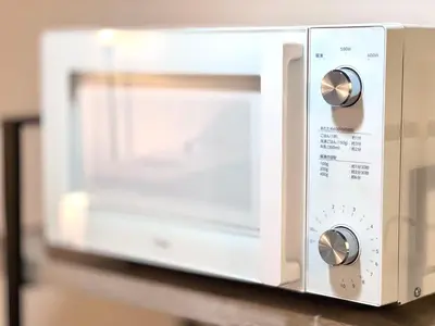 a microwave oven sitting on top of a counter at JUN shinjuku408-SJ0099 in Tokyo