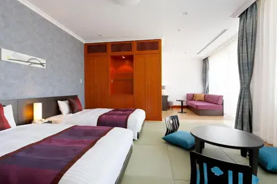 a hotel room with two beds and a table at Ryogoku View Hotel in Tokyo