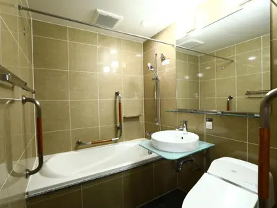 a bathroom with a sink and a tub and a toilet at APA Hotel Higashi Shinjuku Kabukicho in Tokyo