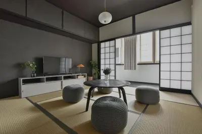 a living room with a table and some stools at Okada Building - Vacation STAY 16358 in Tokyo
