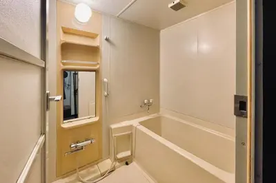 a bathroom with a tub and a sink at Okada Building - Vacation STAY 16358 in Tokyo