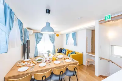 a dining room with a long table and chairs at Modern House Tokyo east in Tokyo