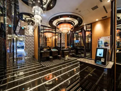 a bar in a building with a chandelier at APA Hotel AkihabaraSuehirocho Ekimae -Electric Town- in Tokyo