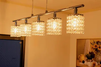a group of four lights hanging from a ceiling at \u5409\u5c4b in Tokyo