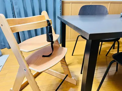 a wooden chair sitting next to a table at Sui HOUSE \u5317\u8d64\u7fbd in Tokyo