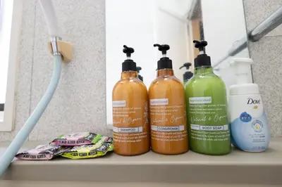 three bottles of cleaning products sitting on a shelf at Sui HOUSE \u5317\u8d64\u7fbd in Tokyo
