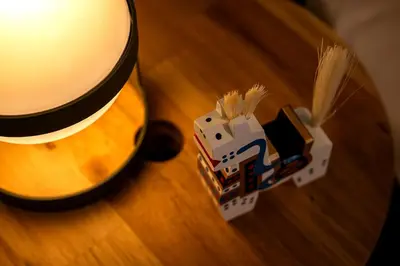 a table with a lego toy on a table next to a lamp at \u30d9\u30eb\u30d3\u30e5\u30fc\u516b\u5e83 in Tokyo