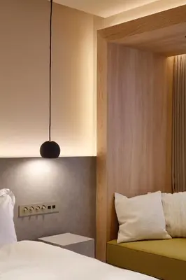 a bedroom with a bed and a pendant light at HotelCO Kuramae \u30db\u30c6\u30eb \u30b3 \u8535\u524d in Tokyo
