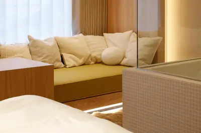 a room with a couch with pillows on it at HotelCO Kuramae \u30db\u30c6\u30eb \u30b3 \u8535\u524d in Tokyo