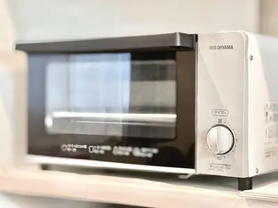 a microwave oven sitting on top of a shelf at Ichigayayanagichō 牛込柳町一户建-SJ0186 in Tokyo