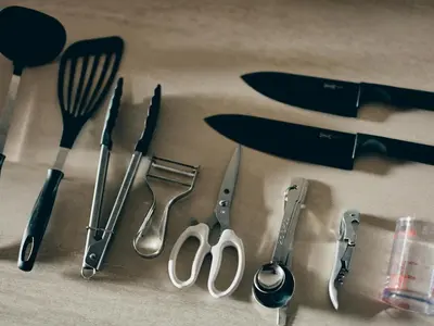 a group of kitchen utensils sitting on top of a table at illi Enu Yotsuya in Tokyo