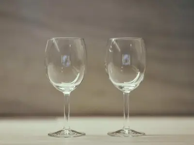 two empty wine glasses sitting on a table at illi Enu Yotsuya in Tokyo