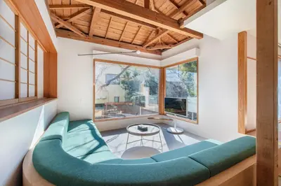 a room with a blue couch and a table at TOsuiKYO in Tokyo
