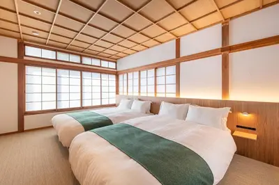 two large beds in a room with windows at TOsuiKYO in Tokyo