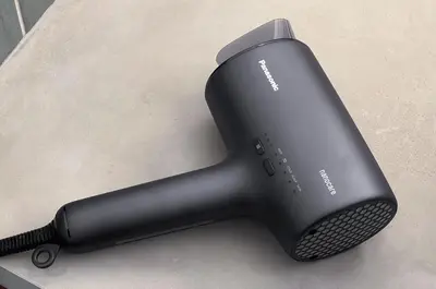 a black hair dryer sitting on a counter at TOsuiKYO in Tokyo