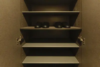 a pair of shoes sitting on a shelf in a closet at Hotel Dieu Nakanobu by Tranova in Tokyo