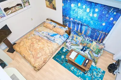 an overhead view of a bedroom with a bed at Van Gogh Tokyo Shinjyuku Shibuya New Open ! in Tokyo