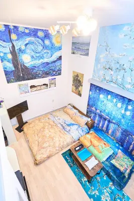 a room with two beds and a painting on the wall at Van Gogh Tokyo Shinjyuku Shibuya New Open ! in Tokyo