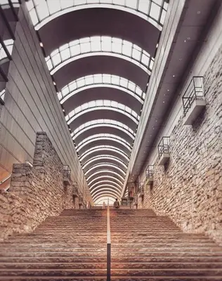 a stairway with a stone wall and a ceiling at Van Gogh Tokyo Shinjyuku Shibuya New Open ! in Tokyo