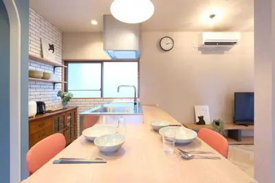 a kitchen with a table with four bowls on it at \u76ee\u9ed2\u672c\u753a\uff5cMeguro Honcho in Tokyo